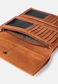 Brown leather wallet with multiple card slots, two transparent ID pockets, and a zippered compartment. Textured surface and neat stitching.