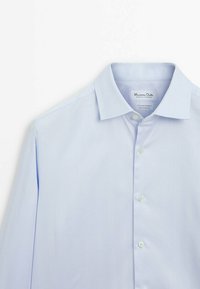 Light blue button-up shirt made of smooth fabric, featuring a pointed collar and long sleeves with a plain design and six buttons.