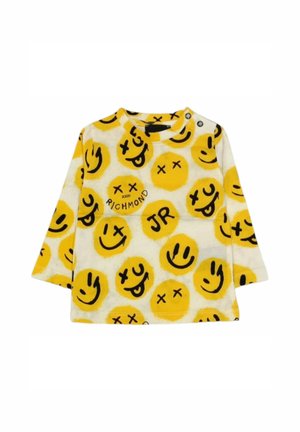 Maglietta a maniche lunghe per bambini realizzata in tessuto bianco con motivi di faccine sorridenti gialle e accenti neri. Include il testo "UNISCITI A RICHMOND JR".