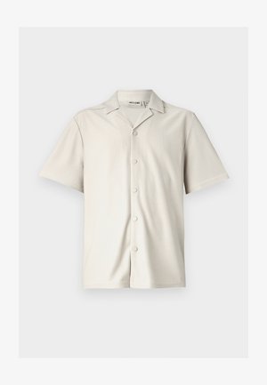 Kortebloem, lichtbeige overhemd met knoopsluiting en een puntige kraag, geribbelde textuur en vijf ronde knopen aan de voorkant.