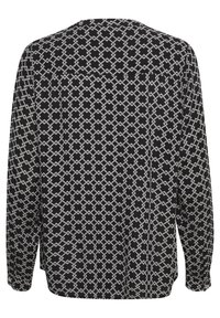 Svart långärmad blus med vitt geometriskt mönster av sammanflätade kors, med en lös passform och knappade ärmslut.