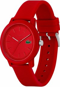 Orologio da polso in silicone rosso con cinturino texturizzato e cassa abbinata. Presenta un quadrante minimalista, indicatori delle ore prominenti e un accento con il logo.