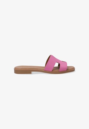 Roze slide-sandaal met uitsnijdingen, vlakke bruine zool, synthetisch bovenwerk en een gladde textuur. Casual en eenvoudig te dragen.