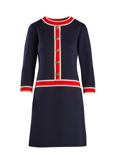 Navy knit dress with three-quarter sleeves, white and red stripes at the collar and hem, and gold front buttons along the center.