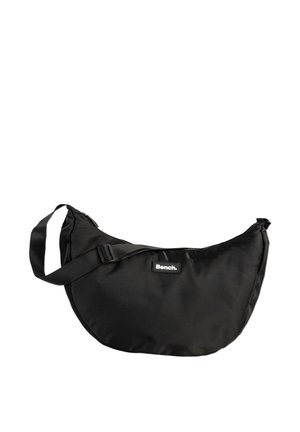 Black nylon shoulder bag with a curved design, adjustable strap, and a small label featuring the brand name "Bench." Smooth texture.