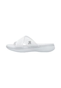 White slide sandals with perforated cross straps, cushioned sole, and textured footbed. Features a subtle logo on the outer strap.