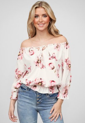 Blusa bianca off-the-shoulder con motivo floreale rosa, scollatura elasticizzata e un nodo frontale. Caratterizzata da maniche lunghe a sbuffo e una vestibilità rilassata.