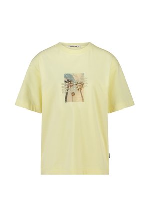 Light yellow short-sleeve T-shirt with central photo of palm trees and repeated text "SANTA MONICA" in diagonal lines.