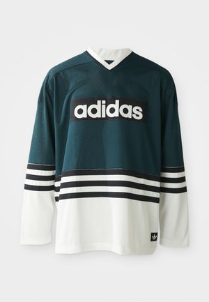 Maglia sportiva a maniche lunghe Adidas in rete verde scuro e bianco con strisce nere e bianche, logo Adidas centrato sul petto.