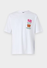 White cotton t-shirt with short sleeves, featuring pink "SR" graphic and a green plant pot design, accompanied by text below.