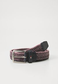 Elastic woven belt in navy, red, and white. Features a matte silver buckle and leather accents. Textured herringbone pattern throughout.
