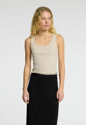Beige ribbed tank top with wide neckline, paired with a black skirt. Smooth texture with a fitted design, no visible patterns or accents.