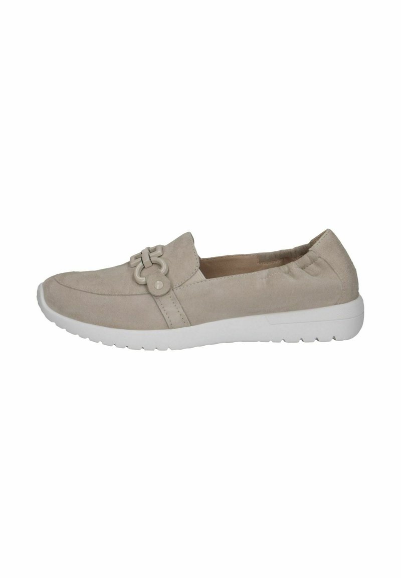 Beige nahk-sneakerid valge kummitaldiga, kaunistatud dekoratiivse nupuvajutusega pealispinnal ja elastsete külgedega, mis tagavad mugava selgemise.