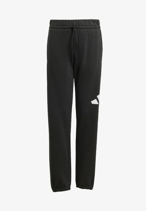 Pantaloni della tuta neri realizzati in tessuto morbido, con vita elasticizzata e coulisse, gambe affusolate e un logo bianco sul lato sinistro.