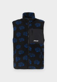 Fekete, bolyhos fleece mellény kék virágmintával, magas gallérral és fekete cipzáras zsebbel a mellkason. Teljes elülső cipzáras záródás.