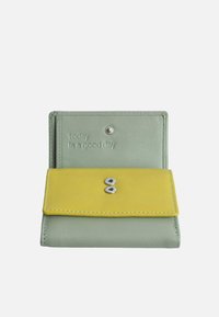 Green leather wallet with a yellow flap, featuring two metal snaps and embossed text reading "today is a good day." Smooth texture, stitched edges.