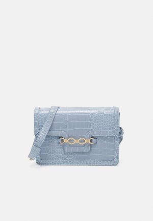 Light blue rectangular crossbody bag with crocodile texture, flap closure, gold chain detail, and adjustable shoulder strap.