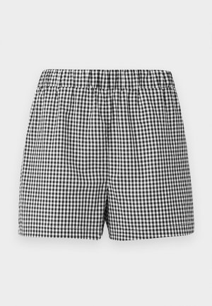 Sorte og hvide ternede shorts med elastisk talje og afslappet pasform. Lavet af letvægtsstof. Ingen yderligere detaljer eller lommer.