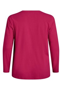 Langærmet skjorte i lyserød bomuld, med rund hals og lige kant, med en glat tekstur og uden synlige mønstre eller detaljer.