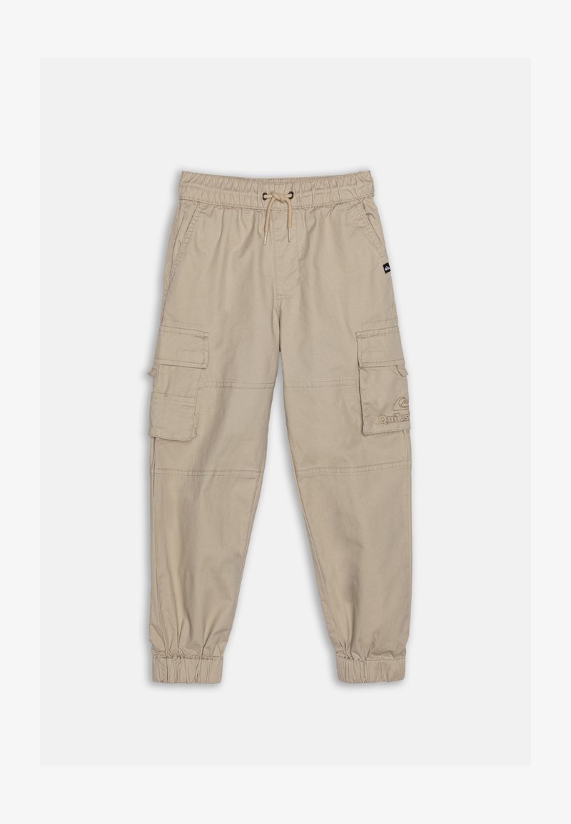 Béžové cargo kalhoty s elastickým pasem a manžetami, které mají dvě boční kapsy a dvě cargo kapsy. Hladká, lehká tkanina.