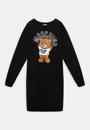 Black sweatshirt dress featuring a large graphic of a bear wearing a white shirt with "TOY." Relaxed fit, long sleeves, ribbed cuffs.