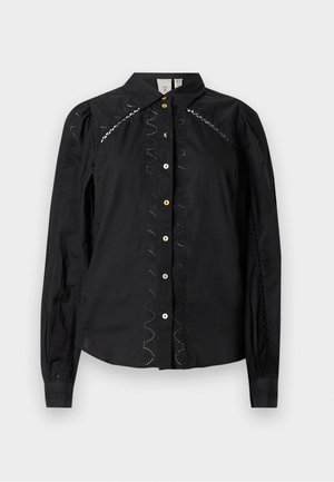 Melna krekla ar garām piedurknēm, ar izšūtām akcentiem gar malām un kontrastējošām pogām. Asu audumu ar strukturētu apkakli.