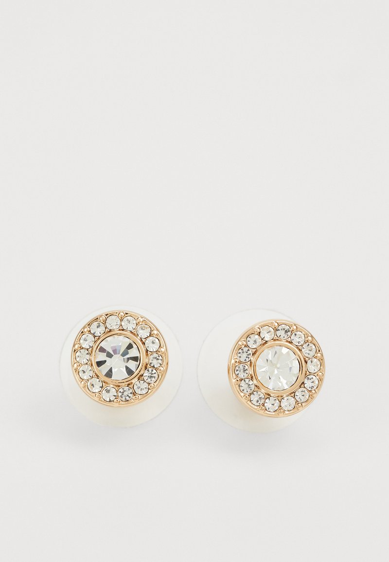 Ümarad tilg earrings, millel on valged keraamilised alused ja kuldse tooni ringikujulised aksessuaarid, kaunistatud selgete rhinestone'ide ja keskmise kristalliga.