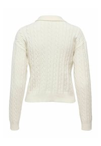 Svetar boje krem s pletenim uzorkom, ovratnikom i blago skraćenim dugim rukavima. Mekana tekstura i uska struk.