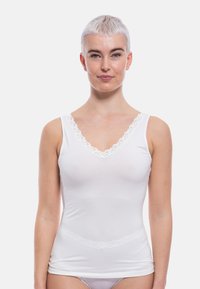 White tank top made of soft fabric, featuring a V-neck with lace trim, thin shoulder straps, and a fitted design.