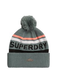 Dzianinowa czapka w kolorze teal z pomponem na czubku. Posiada poziome paski w kolorze koralowym, białym i czarnym. Wyróżniające się logo "SUPERDRY" w grubym czarnym fontzie.