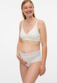 Άσπρο σουτιέν εγκυμοσύνης με απαλή, λεία υφή και δαντελένιο φινίρισμα. Τα σλιπ με ψηλή μέση διαθέτουν δαντελένια μέση και στερεό ύφασμα.