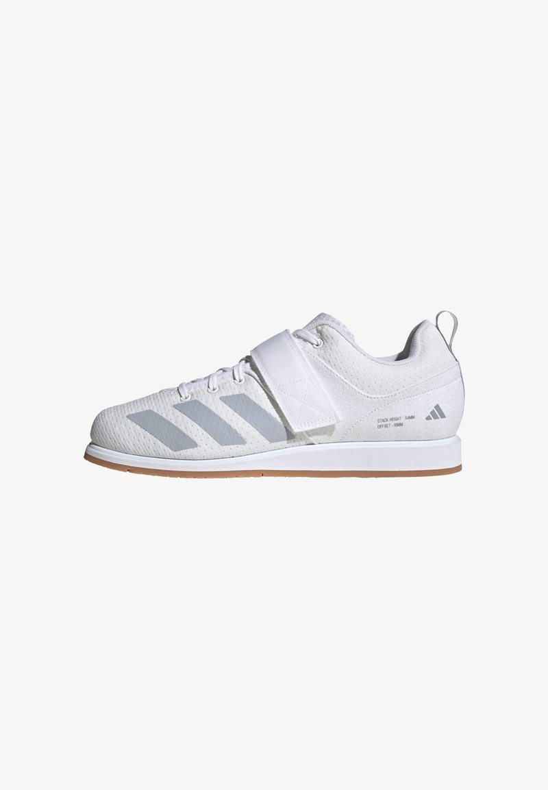Chaussure de sport blanche Adidas avec des rayures grises, lacets à l'avant, fermeture velcro et semelle brun clair, vue de profil.