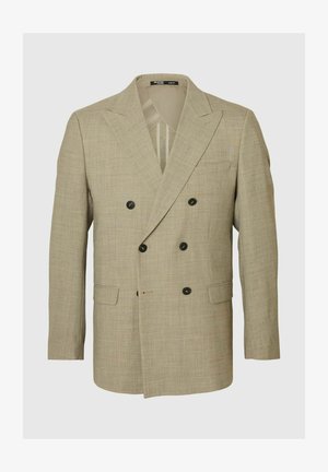 Beżowy dwurzędowy żakiet wykonany z teksturowanej tkaniny, z klapami, czarnymi guzikami i dwiema bocznymi kieszeniami.