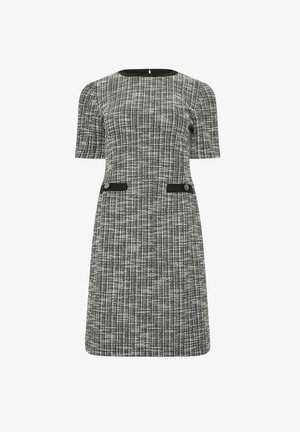 Sukienka w haftowany wzór w czarno-białe, z krótkimi rękawami, okrągłym dekoltem, dwiema przednimi kieszeniami z czarnymi akcentami oraz prostą spódnicą.