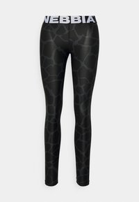 Fekete leggings zsiráf mintával, rugalmas anyagból készültek. A derékpánton fehér "NEBBIA" logó található. Sima tapintású.