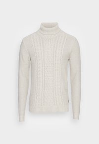 Ljuscremefärgad polotröja i stickad material. Har strukturerade mönster och ribbade muddar samt fåll. Klassisk passform med flätstickning.