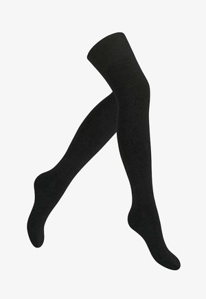 Chaussettes noires au-dessus du genou fabriquées en un tissu doux et extensible. Texture lisse avec une couleur unie et sans motifs ni accents visibles.