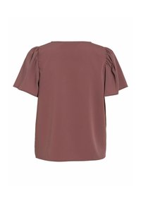 Top a maniche corte di colore rosa polveroso. Presenta maniche a palloncino e un semplice scollo rotondo. Realizzato in un tessuto leggero e liscio.