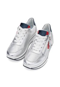 Silver perforated sneakers with blue and red accents, featuring a lace-up design and side zipper, textured surface, and round toe.