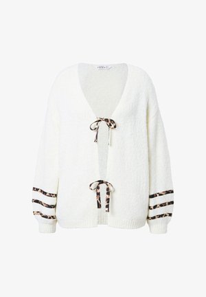 White, textured cardigan with a deep V-neck, leopard print ties, and striped accents on sleeves. Soft knit construction for warmth.