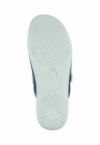 Rubber outsole with a textured grip pattern, navy felt upper, and white accent around the base. Features branding near the heel.