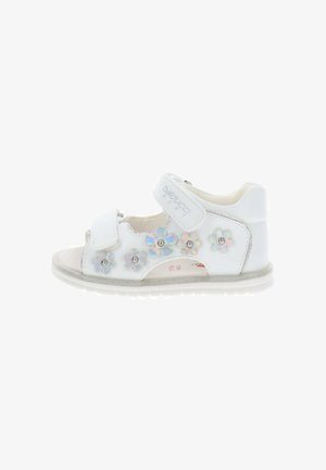 Sandalo bianco per bambini con due cinturini regolabili e applicazioni floreali iridescenti decorative lungo il lato.