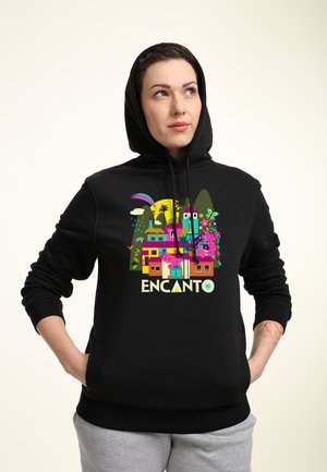 Black hoodie featuring a colorful graphic of stylized buildings and nature with the text "ENCANTO." Material appears soft with a simple design.