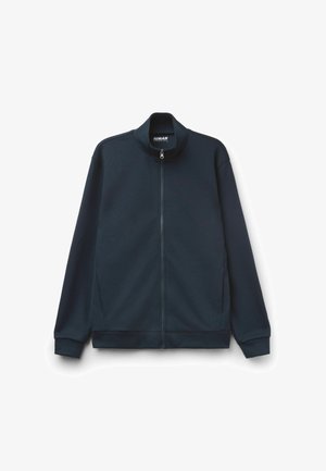 Marineblaue Zip-Jacke mit hohem Kragen, langen Ärmeln und gerippten Bündchen und Saum. Glatter Stoff und minimalistisches Design.