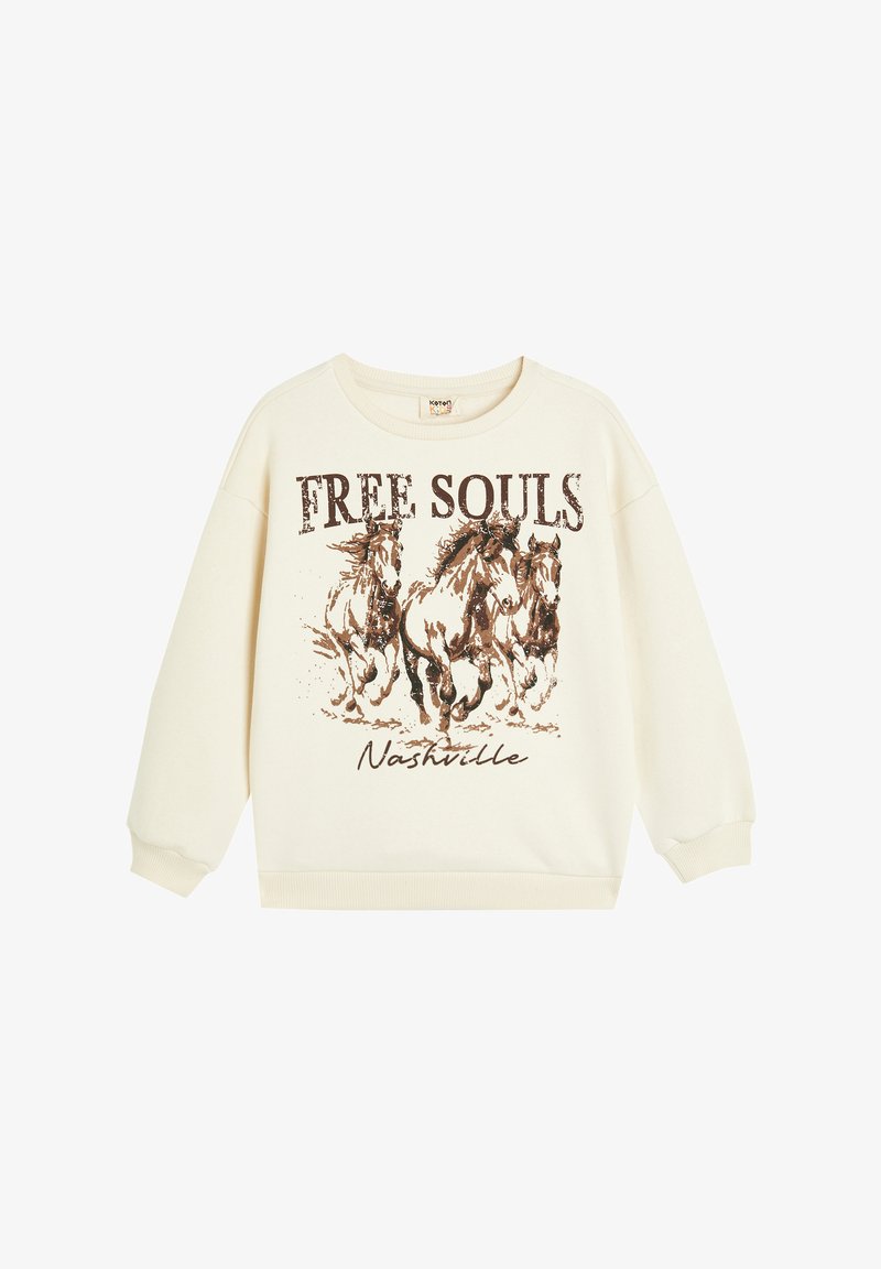 Sudadera de color crema con un corte oversized, con un gráfico de caballos galopantes y la inscripción "FREE SOULS Nashville" en texto marrón.