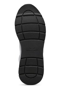 Schwarze Gummi-Schuhsohle mit strukturierten Grip-Mustern, tiefen Rillen und einem zentralen Logo. Leicht angehobene Kanten um den Umfang.