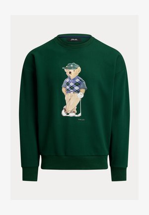 Zielona bluza z grafiką niedźwiedzia w stroju golfowym, w koszuli w kratę i czapce, wykonana z wygodnej tkaniny z prążkowanymi mankietami.