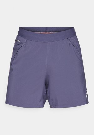 Men's athletic shorts in purple, made of lightweight fabric. Features an elastic waistband and side pockets with a small logo on the hem.