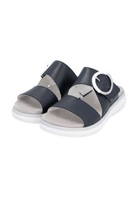 Navy blue slide sandals with wide leather straps, silver circular buckle detail, soft gray footbed, and white rubber sole.
