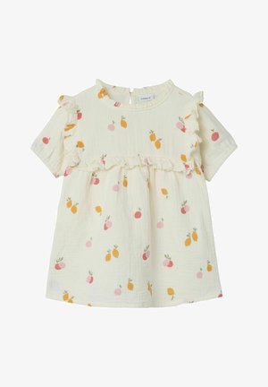 Robe bébé crème à manches courtes, bordure à volants et motif de fruits orange et rose sur toute la robe.